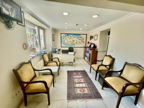 a waiting room with chairs and a table at Timeks Suite Sultanahmet in Istanbul
