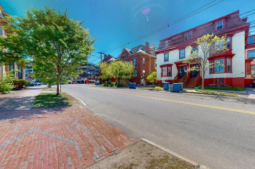 an empty street in a small town with buildings at Cumberland Casa - A in Portland
