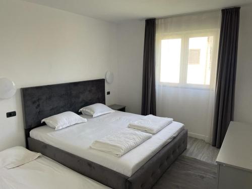 En eller flere senge i et værelse på Casa de Vacanță Topaz