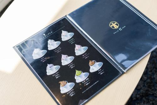 a box with a picture of cats wearing hats at Tokyu Stay Hakodate Asaichi Akarinoyu in Hakodate