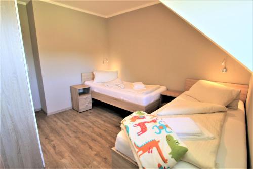 Postel nebo postele na pokoji v ubytování Fehmarnhaus 2