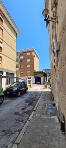 a car parked on a street next to a building at Dorico Apartment in Ancona