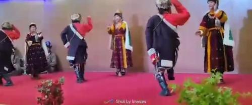 a group of people dressed in costumes on a red carpet at The Royal Maryul Banquet Hall , Restaurant & Resort - Leh in Stak