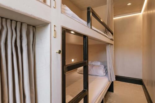 a couple of bunk beds in a room at Gather - STAY LAGOM in Ballycastle