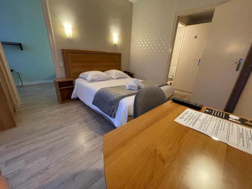 Ένα ή περισσότερα κρεβάτια σε δωμάτιο στο Le Relais De La Place