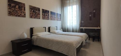 Ένα ή περισσότερα κρεβάτια σε δωμάτιο στο Casa Vacanze A Pennichella