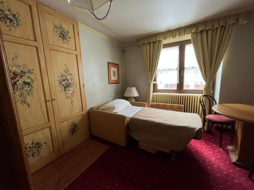 Posteľ alebo postele v izbe v ubytovaní Hotel Posta R.T.A.