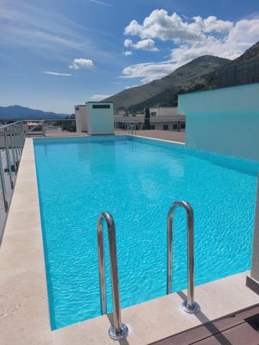 a swimming pool on the roof of a building at Trebinje Lux Apartment in Trebinje