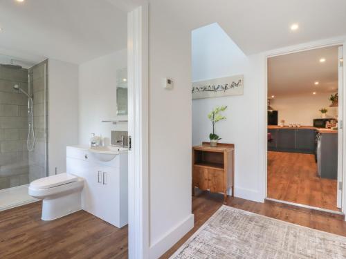 a bathroom with a toilet and a sink at The Old Dairy in Canterbury