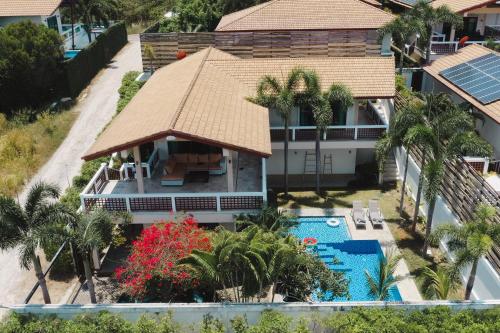 an aerial view of a house with a swimming pool at Cliff Haven Villa Krabi in Ao Nang Beach