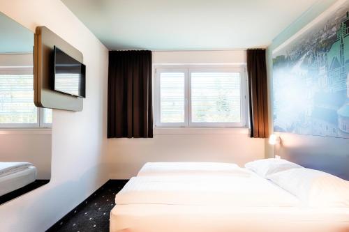 Posteľ alebo postele v izbe v ubytovaní B&B Hotel Salzburg-Nord