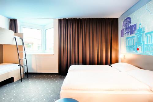 Postel nebo postele na pokoji v ubytování B&B Hotel Wien-Meidling