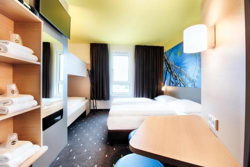 Postel nebo postele na pokoji v ubytování B&B Hotel Rust-Ettenheim