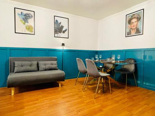 a living room with a couch and a table at Garibaldi Accommodation in Viterbo