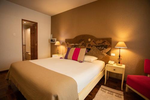 Кровать или кровати в номере Hotel Rosario La Paz