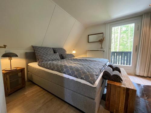 Posteľ alebo postele v izbe v ubytovaní Ferienhaus mit Teich auf 16.000m² in der Natur
