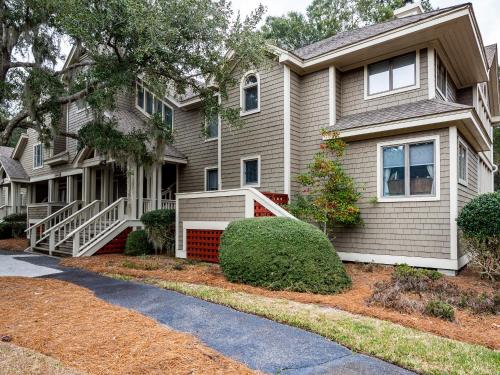 a house with a pathway in front of it at 2780 Live Oak Villa in Seabrook Island