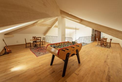 a room with a table in the middle of a room at Aux Truffes de Combecave in Mauroux