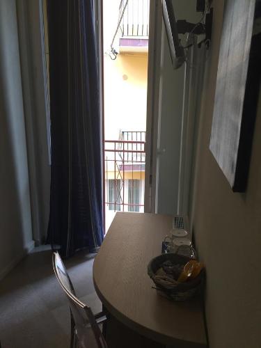a table and two chairs in a room with a window at La Rosa Dei Venti in Monterosso al Mare