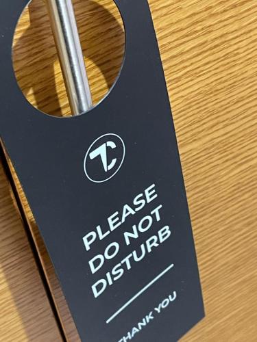 a sign that says please do not disturb at The Crown London, WorldHotels Distinctive in London