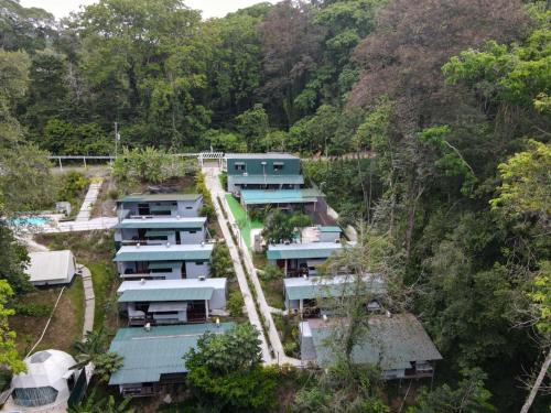 an aerial view of a village in the forest at HOTEL, VILLAS y GLAMPINGS MYA -PUERTO VIEJO, Limon, CR in Puerto Viejo
