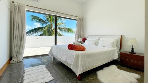 מיטה או מיטות בחדר ב-Beach Penthouse BELMARE