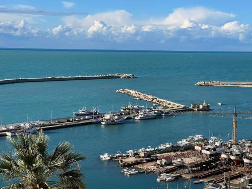 a view of a marina with boats in the water at MARE CELESTE APPARTAMENTO in Sciacca