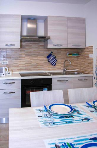 a kitchen with a table with a plate on it at U Fundu du Cialli in Lavagna