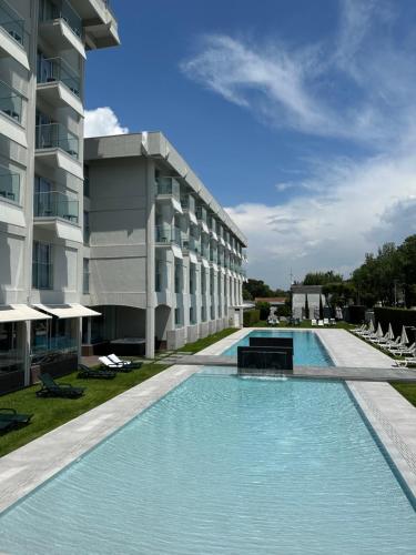 a large swimming pool in front of a building at Hotel do Parque in Viana do Castelo