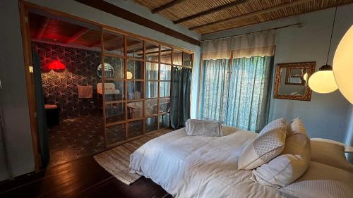 Un pat sau paturi într-o cameră la Hotel Dios