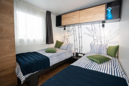 Postel nebo postele na pokoji v ubytování Veranda Mobile Home - Terra Park SpiritoS