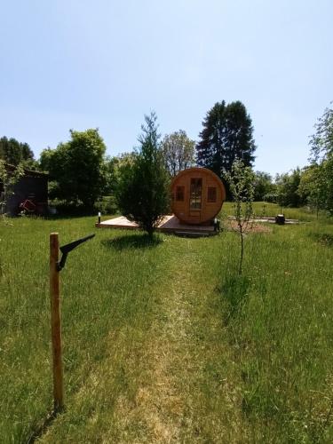 a tiny house in the middle of a field at Les Cabanes d'Hérande - Le Millésime in Fouchères