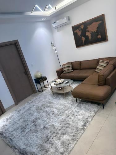 a living room with a couch and a table at Studio Haut standing de dernière génération in Dakar