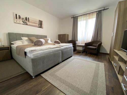 Postel nebo postele na pokoji v ubytování Édes-Kettes Apartman