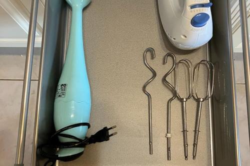a group of tools sitting on the floor in a drawer at CHALET GAMSBOCK Koralpe in Elsenbrunn