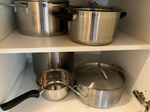 two pots and pans on a shelf in a kitchen at CHALET GAMSBOCK Koralpe in Elsenbrunn