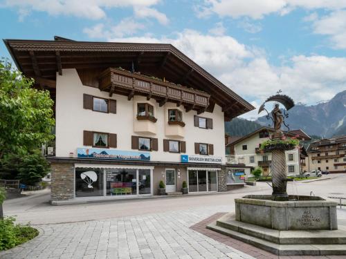 a building with a statue in front of it at Haus Eberharter in Mayrhofen