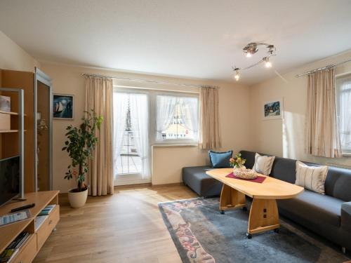 a living room with a couch and a table at Haus Eberharter in Mayrhofen