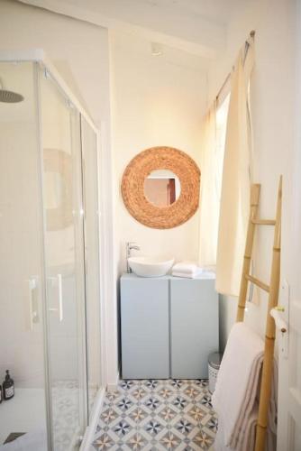 a bathroom with a sink and a mirror at Domaine de Matourne in Flayosc