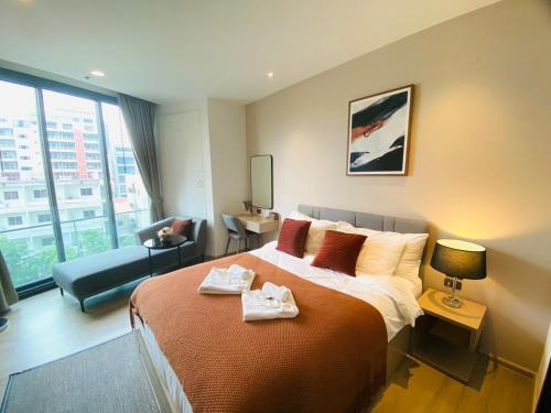 Ένα ή περισσότερα κρεβάτια σε δωμάτιο στο Edge Central Pattaya Vip Condo