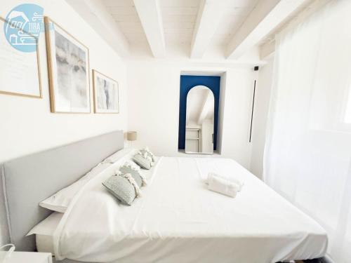 Llit o llits en una habitació de San Rocco Sweet Apartments