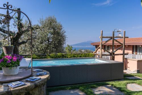 a swimming pool in the backyard of a house at VILLA CARUSO PRIVATE HEATED POOL & SEA VIEW in Sorrento