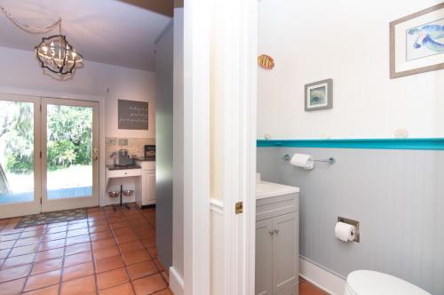 a bathroom with a toilet and a sink at 3236 Middle Dam Court in Johns Island