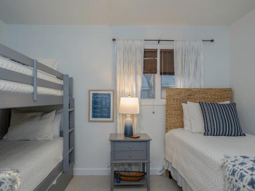 Postel nebo postele na pokoji v ubytování 1129 Summerwind Cottage