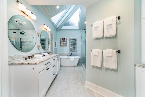 a bathroom with a sink and a mirror at 2251 Catesby's Bluff in Seabrook Island