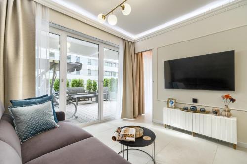 TV a/nebo společenská místnost v ubytování Apartments Ostsee Suntowers TARAS