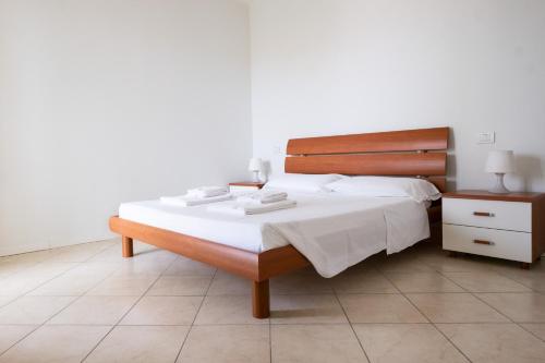 Katil atau katil-katil dalam bilik di Gardappartamenti Costa Pool
