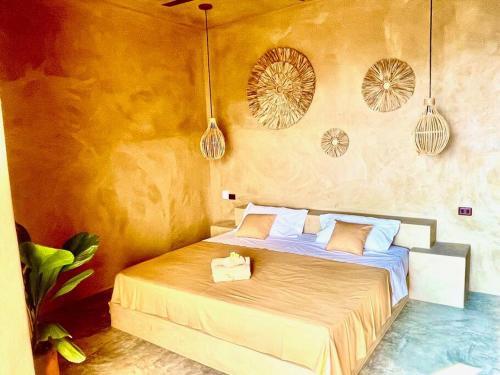 En eller flere senge i et værelse på Casa Maloya alberca y vista al mar