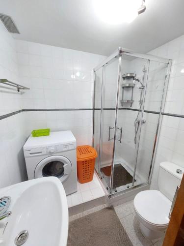 a bathroom with a shower and a toilet and a sink at Sun apartment Antigua in Costa de Antigua