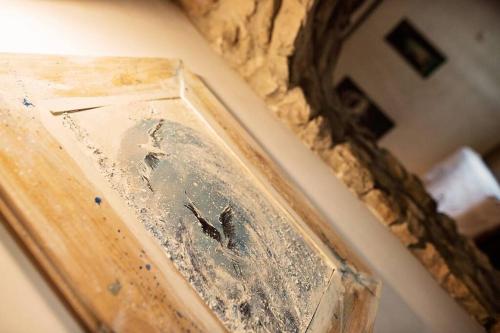 a close up of a bath tub with a mirror at Holiday home Raos - a special stonehouse, Brela in Brela